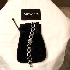 MOVADO Women,s Stainless Steel Watch With 7 Diamonds.